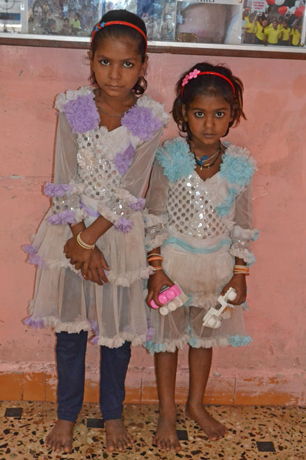 two slum sisters in their party dresses
